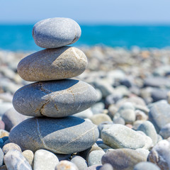 Stones balance, pebbles stack over blue sea. Beauty world.