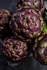 Fototapeta premium Market fresh purple artichokes in wooden crate