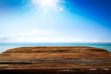 Desk of free space and summer background of sea 
