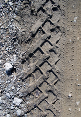 car tire tracks on wet muddy trail royalty, road, abstract background, texture material. Tyre track on dirt sand or mud, retro tone, grunge tone, drive on sand, off road