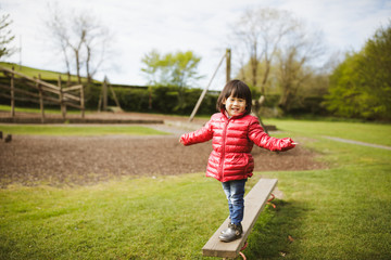toddler girl play at outdoor playground