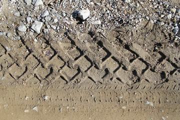 car tire tracks on wet muddy trail royalty, road, abstract background, texture material. Tyre track...