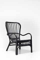 Modern black armchair on the white background