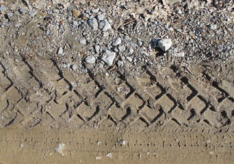 car tire tracks on wet muddy trail royalty, road, abstract background, texture material. Tyre track...