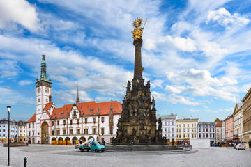 Panorama of the Square and the Holy Trinity Column in Olomouc, Czech Republic under beautiful cloudy sky - obrazy, fototapety, plakaty