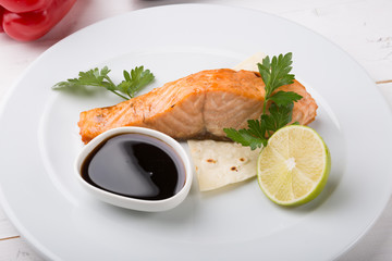 Prepared salmon steak served on a plate