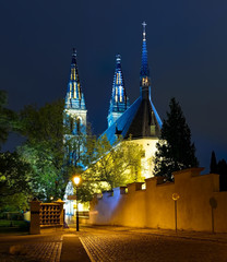 The Basilica of St Peter and St Paul - neo-Gothic church in Vyshegrad fortress in Prague, Czech Republic in night illumination