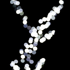 Bokeh white lights on black background. Abstract defocused many round light