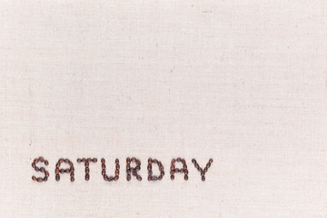 The word Saturday written with coffee beans , aligned at the bottom left.