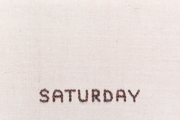 The word Saturday written with coffee beans , aligned at the bottom.