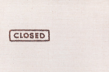 The word Closed inside a rectangle written with coffee beans,aligned to the left.