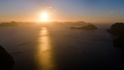 Sunset over the sea with the islands. Seascape with sunset aerial view