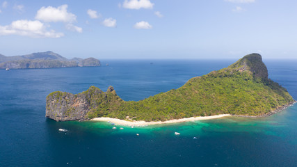 Tourists relax on the white beach of the island of Helikopter.Tropical white sand beach. Seascape with tropical islands. © Tatiana Nurieva