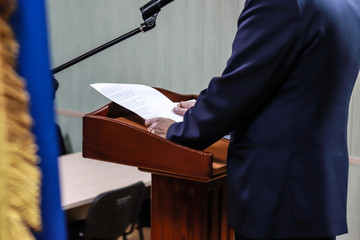 speaker behind the podium