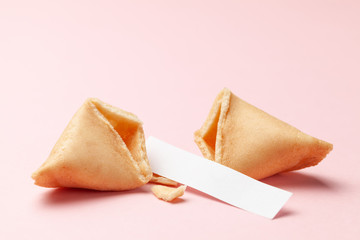 Chinese fortune cookies. Cookies with empty blank inside for prediction words. Pink background Copy...