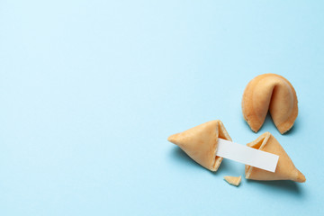 Chinese fortune cookies. Cookies with empty blank inside for prediction words. Blue background Copy...