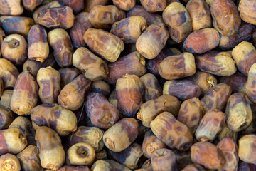 many dried dates lie on the whole frame