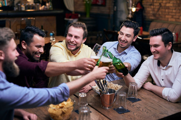 Men making a cheers for good weekend