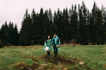 rain on your wedding day. An excellent reason to hold a photo shoot in raincoats
