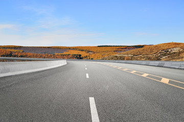 Empty highways and distant mountains