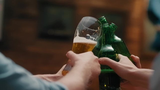 Friend with beer glass making a cheers