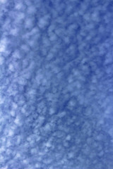  Cirrocumulus cloud spreading in the blue sky
