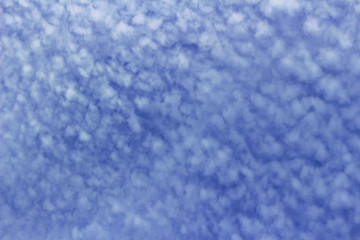  Cirrocumulus cloud spreading in the blue sky