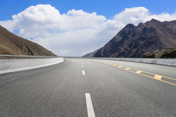 Empty highways and distant mountains