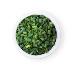 Finely chopped fresh green onions in a generic ceramic bowl isolated on white. Top view.