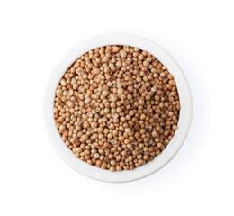 heap of mustard seeds in bowl isolate on white background. top view