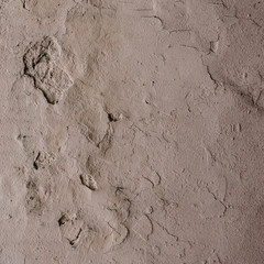 Abstract grunge texture - old battered wall with potholes.