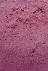 Abstract grunge texture - old battered wall with potholes.