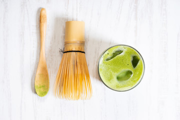 iced green tea, matcha, latte with bamboo whisk