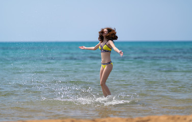 Happy joyful young woman on summer vacation