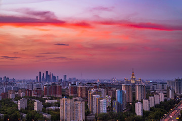 Skyscraper rooftop view on Moscow state University, Moscow City and Vernadskiy avenue at pinky sunset