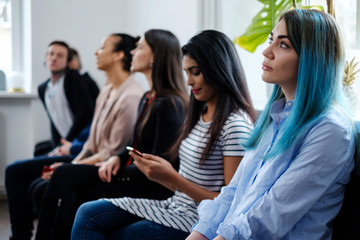 Group of young people waiting for a casting or job interview