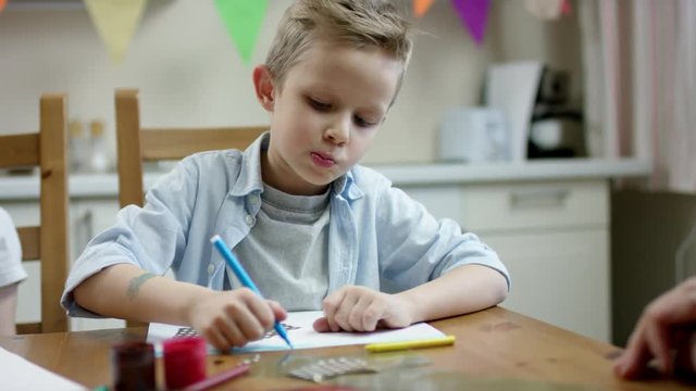 boy draw correct picture with a pen with flow camera