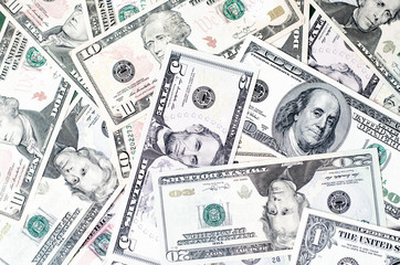 Background of paper notes dollars of different denominations.