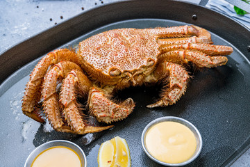 boiled hairy crab on black plate