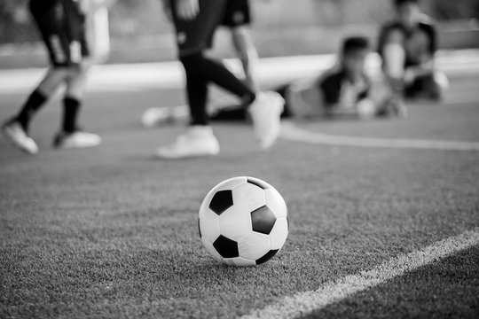 Black and white picture of Soccer ball on artificial turf