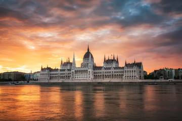 Fototapeta premium Budapest Parliament at sunrise / Amazing fiery sunrise above Hungarian Parliament in Budapest