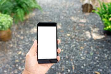 Mockup image of Woman hand holding mobile smartphones isolated white screen for mockup design and others app display background. Graphic design montage
