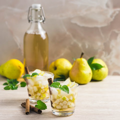 Pear cinnamon kombucha cocktail. Selective focus, space for text.