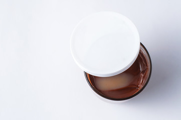 Tasty chocolate spread in jar isolated on white background