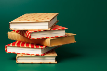 books isolated on green background