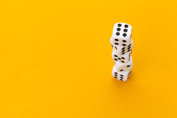 dice on a yellow background