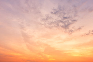Naklejka na ściany i meble Orange sky background texture with white clouds sunset.