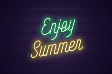 Fototapeta na wymiar Neon lettering of Enjoy Summer. Glowing text