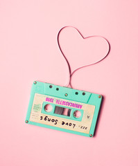  Audio tape with heart shaped tape on pink background