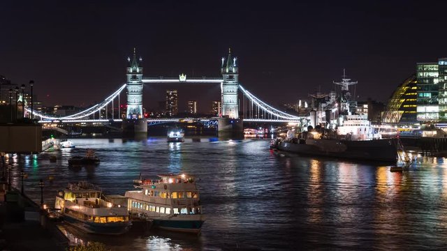 Time lapse of London's famous Tower Bridge being raised to let a large boat sail underneath.